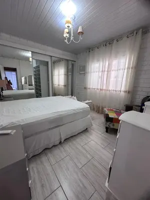 Uma cama ou camas num quarto em Casa em Bombas
