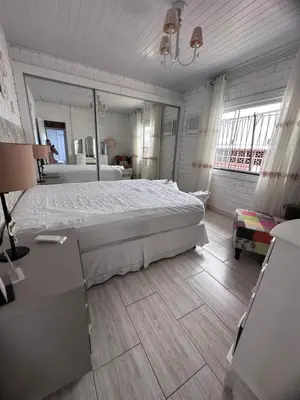 Uma cama ou camas num quarto em Casa em Bombas