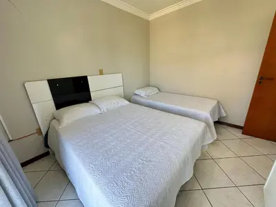 Uma cama ou camas num quarto em Residencial Paradise - Praia de Bombas - Bombinhas