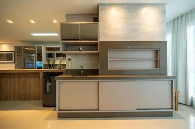 A cozinha ou kitchenette de Achei Itapema • Elegante ap 3 suítes 400m do mar