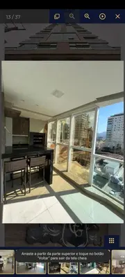 Uma televisão e/ou sistema de entretenimento em Lindo apartamento em Itapema