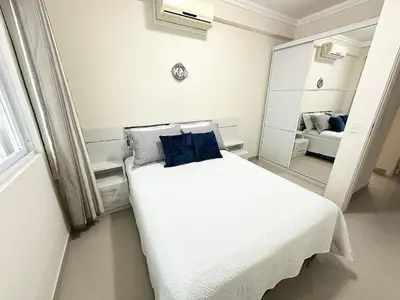 Uma cama ou camas num quarto em Costa Mar Residence - Bombinhas
