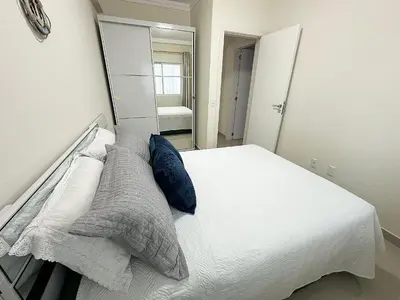 Uma cama ou camas num quarto em Costa Mar Residence - Bombinhas