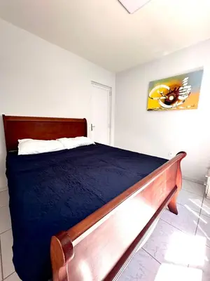 Uma cama ou camas num quarto em Apartamento Térreo Praia de Bombinhas SC