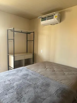 Uma cama ou camas num quarto em Residencial Lara 3