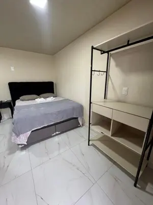 Uma cama ou camas num quarto em Residencial Lara 3