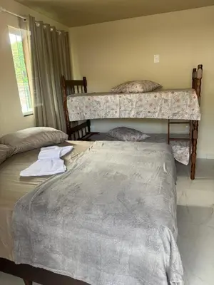 Uma cama ou camas num quarto em Residencial Lara 6
