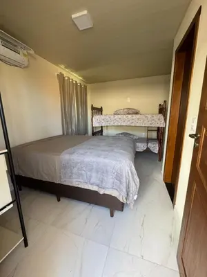 Uma cama ou camas num quarto em Residencial Lara 6