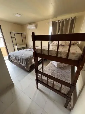 Uma cama ou camas num quarto em Residencial Lara 6
