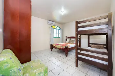 Uma cama ou camas num quarto em #01-Z - (Refúgio e Mar) Hospedagem em Canto Grande, Bombinhas