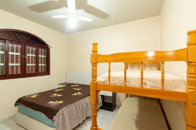 Uma cama ou camas num quarto em #02-Z - (Refúgio e Mar) Hospedagem em Canto Grande, Bombinhas