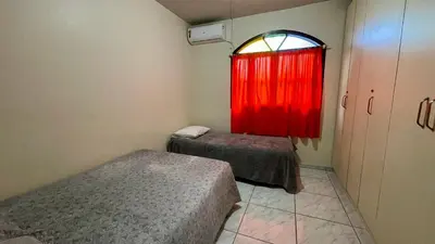 Uma cama ou camas num quarto em #02-Z - (Refúgio e Mar) Hospedagem em Canto Grande, Bombinhas