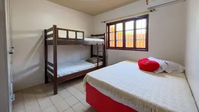 Uma cama ou camas num quarto em #04-M - (Refúgio e Mar) Hospedagem em Canto Grande, Bombinhas