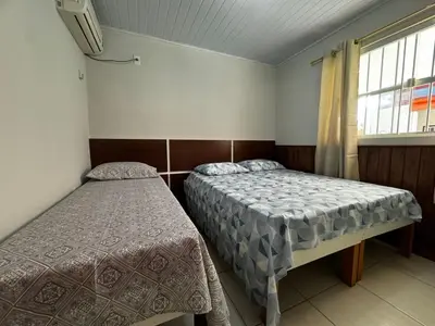 Uma cama ou camas num quarto em #05-B - (Refúgio e Mar) Hospedagem em Canto Grande, Bombinhas