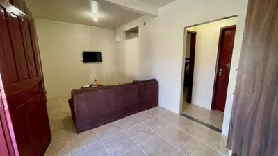 Uma televisão e/ou sistema de entretenimento em #07-B - (Refúgio e Mar) Hospedagem em Canto Grande, Bombinhas