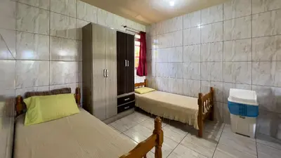 Uma cama ou camas num quarto em #09-M - (Refúgio e Mar) Hospedagem em Canto Grande, Bombinhas