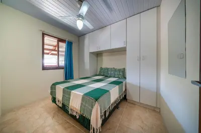 Uma cama ou camas num quarto em #11-CC - (Refúgio e Mar) Hospedagem em Canto Grande, Bombinhas