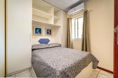 Uma cama ou camas num quarto em #14-T - (Refúgio e Mar) Hospedagem em Canto Grande, Bombinhas