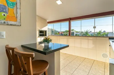A cozinha ou kitchenette de #14-T - (Refúgio e Mar) Hospedagem em Canto Grande, Bombinhas