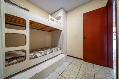 Uma cama ou camas num quarto em #15-T - (Refúgio e Mar) Hospedagem em Canto Grande, Bombinhas