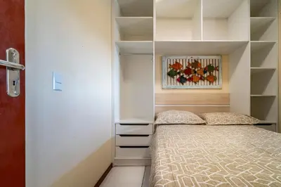 Uma cama ou camas num quarto em #16-T - (Refúgio e Mar) Hospedagem em Canto Grande, Bombinhas