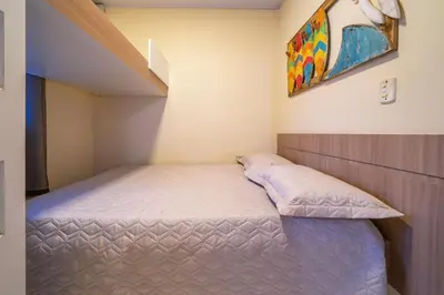 Uma cama ou camas num quarto em #16-T - (Refúgio e Mar) Hospedagem em Canto Grande, Bombinhas