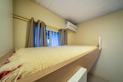 Uma cama ou camas num quarto em #16-T - (Refúgio e Mar) Hospedagem em Canto Grande, Bombinhas