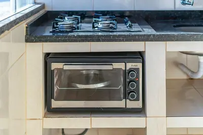 A cozinha ou kitchenette de #17-T - (Refúgio e Mar) Hospedagem em Canto Grande, Bombinhas