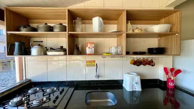 A cozinha ou kitchenette de #18-T - (Refúgio e Mar) Hospedagem em Canto Grande, Bombinhas
