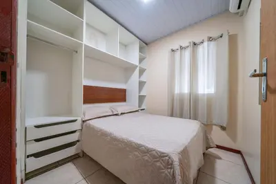 Uma cama ou camas num quarto em #20-T - (Refúgio e Mar) Hospedagem em Canto Grande, Bombinhas