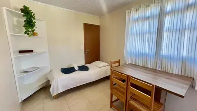 Uma cama ou camas num quarto em #27-CG - (Refúgio e Mar) Hospedagem em Canto Grande, Bombinhas
