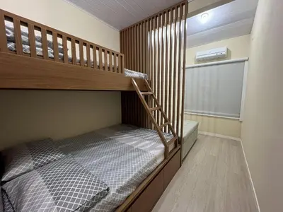 Uma cama ou camas num quarto em #30-E - (Refúgio e Mar) Hospedagem em Canto Grande, Bombinhas