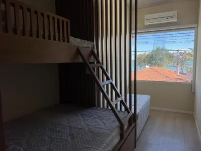 Uma cama ou camas num quarto em #30-E - (Refúgio e Mar) Hospedagem em Canto Grande, Bombinhas