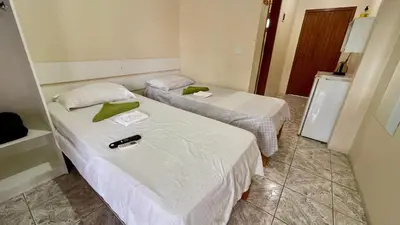 Uma cama ou camas num quarto em #38-MA - (Refúgio e Mar) Hospedagem em Canto Grande, Bombinhas