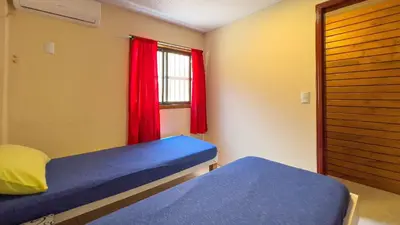 Uma cama ou camas num quarto em #40-B - (Refúgio e Mar) Hospedagem em Canto Grande, Bombinhas