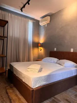 Uma cama ou camas num quarto em Pousada Recanto do canário Suite 1 Green