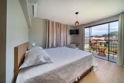 Uma cama ou camas num quarto em #PDS5 - (Refúgio e Mar) Hospedagem em Canto Grande, Bombinhas