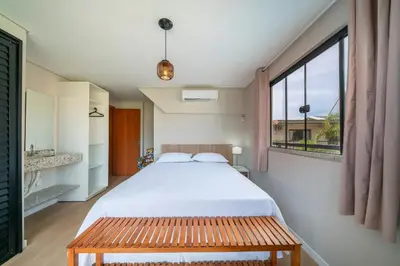 Uma cama ou camas num quarto em #PDS6 - (Refúgio e Mar) Hospedagem em Canto Grande, Bombinhas