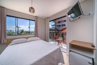 Uma cama ou camas num quarto em #PDS7 - (Refúgio e Mar) Hospedagem em Canto Grande, Bombinhas