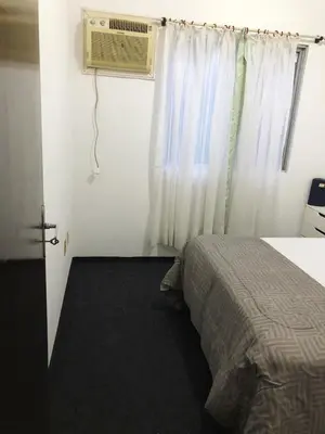 Uma cama ou camas num quarto em Casa grande a 50 metros da praia