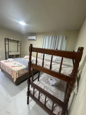 Uma cama ou camas num quarto em Residencial Lara 4