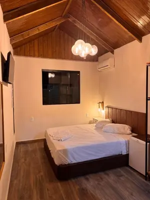 Uma cama ou camas num quarto em Pousada Recanto do Canário Suite 3 Standart