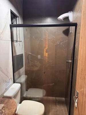 Uma casa de banho em Pousada Recanto do Canário Suite 3 Standart
