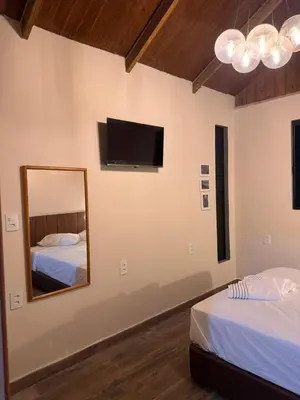 Uma cama ou camas num quarto em Pousada Recanto do Canário Suite 3 Standart