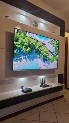 Uma televisão e/ou sistema de entretenimento em ITAPEMA- MEIA PRAIA - 180 M da PRAIA Confortável Apartamento