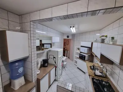 A cozinha ou kitchenette de ITAPEMA- MEIA PRAIA - 180 M da PRAIA Confortável Apartamento