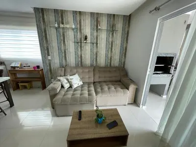 Uma área de estar em Apartamento na praia