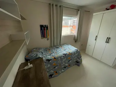 Uma cama ou camas num quarto em Apartamento na praia