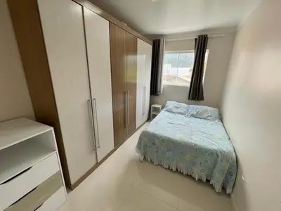 Uma cama ou camas num quarto em Apartamento na praia