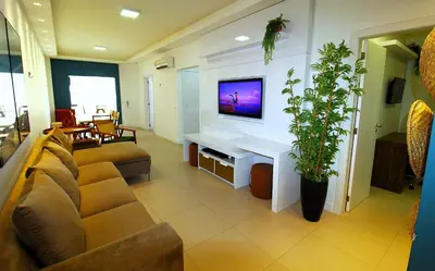 Uma televisão e/ou sistema de entretenimento em 1065 Excelente Apto com vista para o mar-Bombinhas